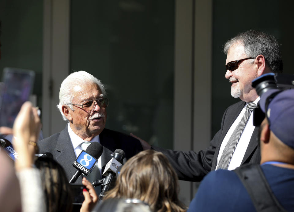 Ruben Flores, left, speaks to the media outside a Salinas, Calif., court after being acquitted of accessory to murder, Tuesday, Oct. 18, 2022. Ruben's son Paul Flores was found guilty of murder in the killing of missing Cal Poly student Kristin Smart. (Daniel Dreifuss/Monterey Weekly via AP)