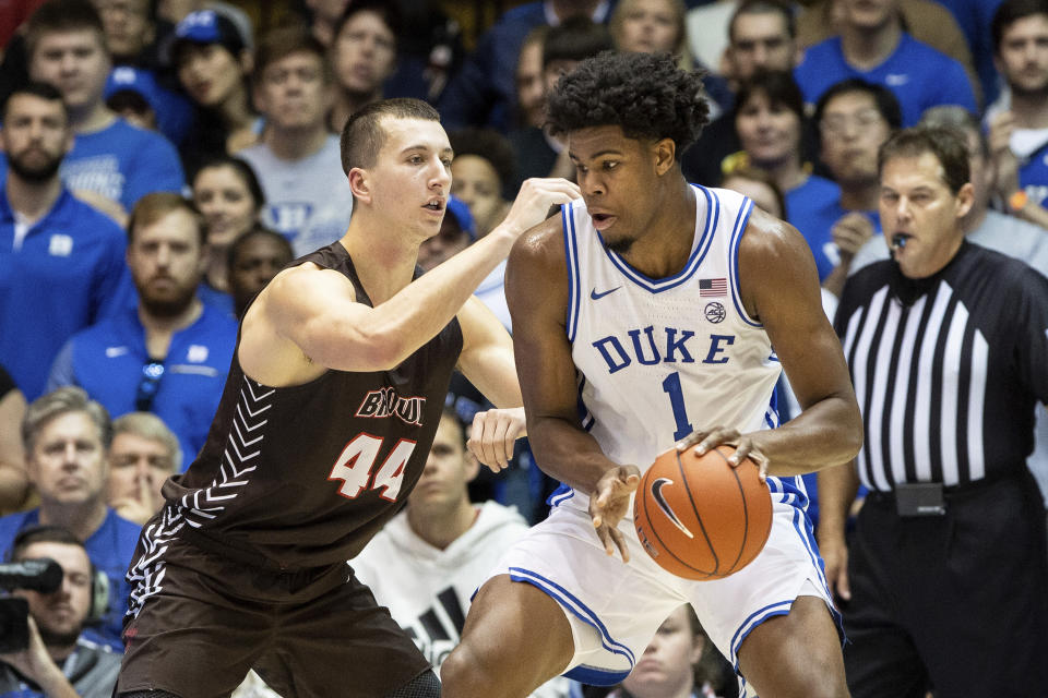 Duke's Vernon Carey Jr. (1) works in the post against Brown's Matt DeWolf (44) during the first half of an NCAA college basketball game in Durham, N.C., Saturday, Dec. 28, 2019. (AP Photo/Ben McKeown)