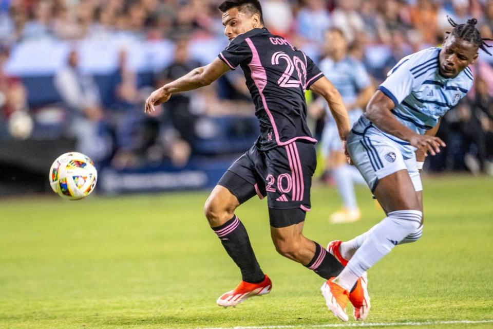 Inter Miami midfielder Diego Gómez (20) kicks the ball away from Sporting Kansas City defender Dany Rosero (5) in the first half of an MLS game at GEHA Field at Arrowhead Stadium on Saturday, April 13, 2024, in Kansas City.