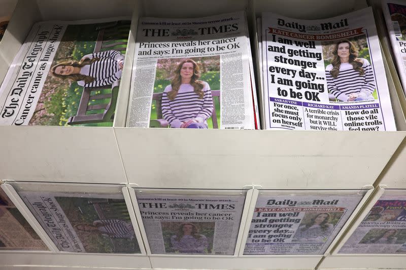 British newspapers with news of Britain's Catherine, Princess of Wales' illness are displayed at a supermarket in London