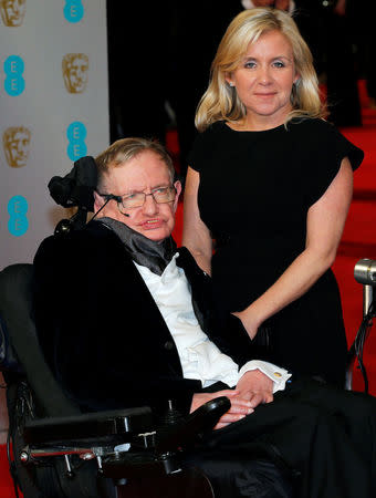 FILE PHOTO: Theoretical physicist Stephen Hawking and his daughter Lucy arrive at the British Academy of Film and Arts (BAFTA) awards ceremony at the Royal Opera House in London February 8, 2015. REUTERS/Suzanne Plunkett/File Photo