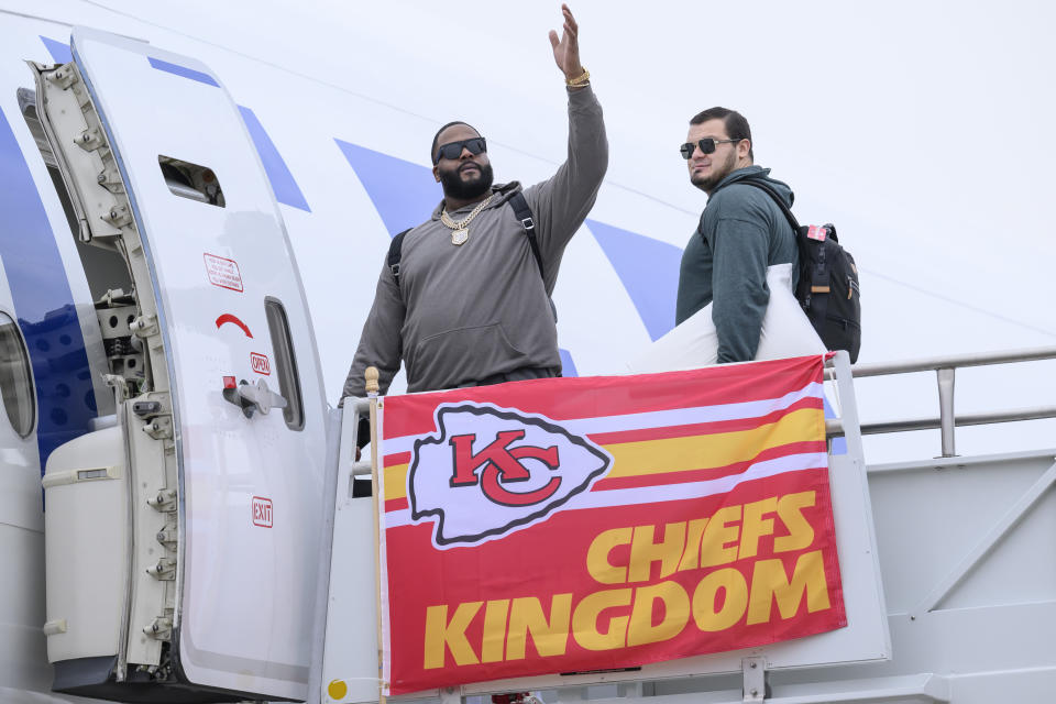 Donovan Smith, left, and Nick Allegretti, right, board a plane with the rest of the Kansas City Chiefs at Kansas City International Airport bound for Las Vegas and NFL football's Super Bowl 58, Sunday, Feb. 4, 2024, in Kansas City, Mo. (AP Photo/Reed Hoffmann)