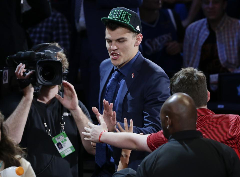 <p>Ante Zizic is congratulated by fans after being selected 23rd overall by the Boston Celtics during the NBA basketball draft, Thursday, June 23, 2016, in New York. (AP Photo/Frank Franklin II) </p>