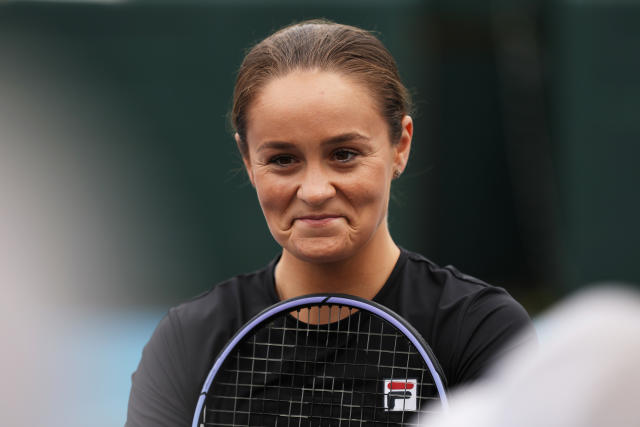 Ash Barty (pictured) smiles as she attends a media opportunity.
