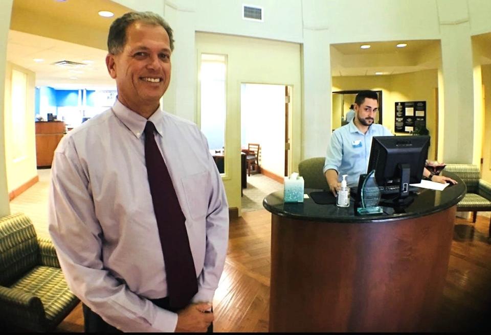 Bruce Page, left, founding CEO of Intracoastal Bank, is pictured at the community bank's original banking center in Palm Coast in 2018. Page, who turned 62 in November 2023, recently announced that the CEO duties will be assumed by his son Ryan, who has been president since January 2021. Ryan turns 33 on Jan. 3, 2024.