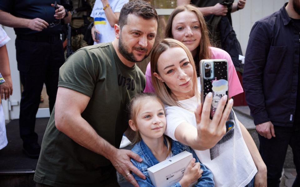 There were plenty of smiles and photos taken with locals during Zelensky's trip to the region - AFP