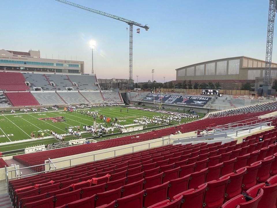 Jones AT&T Stadium is shown on Thursday evening, two nights before Texas Tech's season opener against No. 13 Oregon. A sponsor banner covers the seating area of the south end zone building project that's under construction.