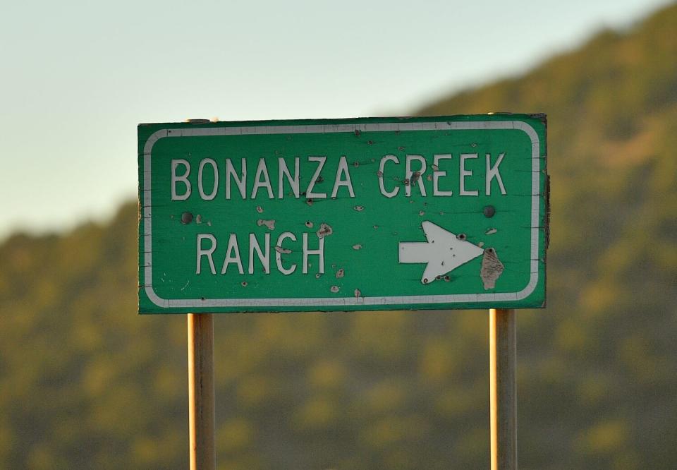 A sign points to the direction of the Bonanza Creek Ranch near Santa Fe, New Mexico.