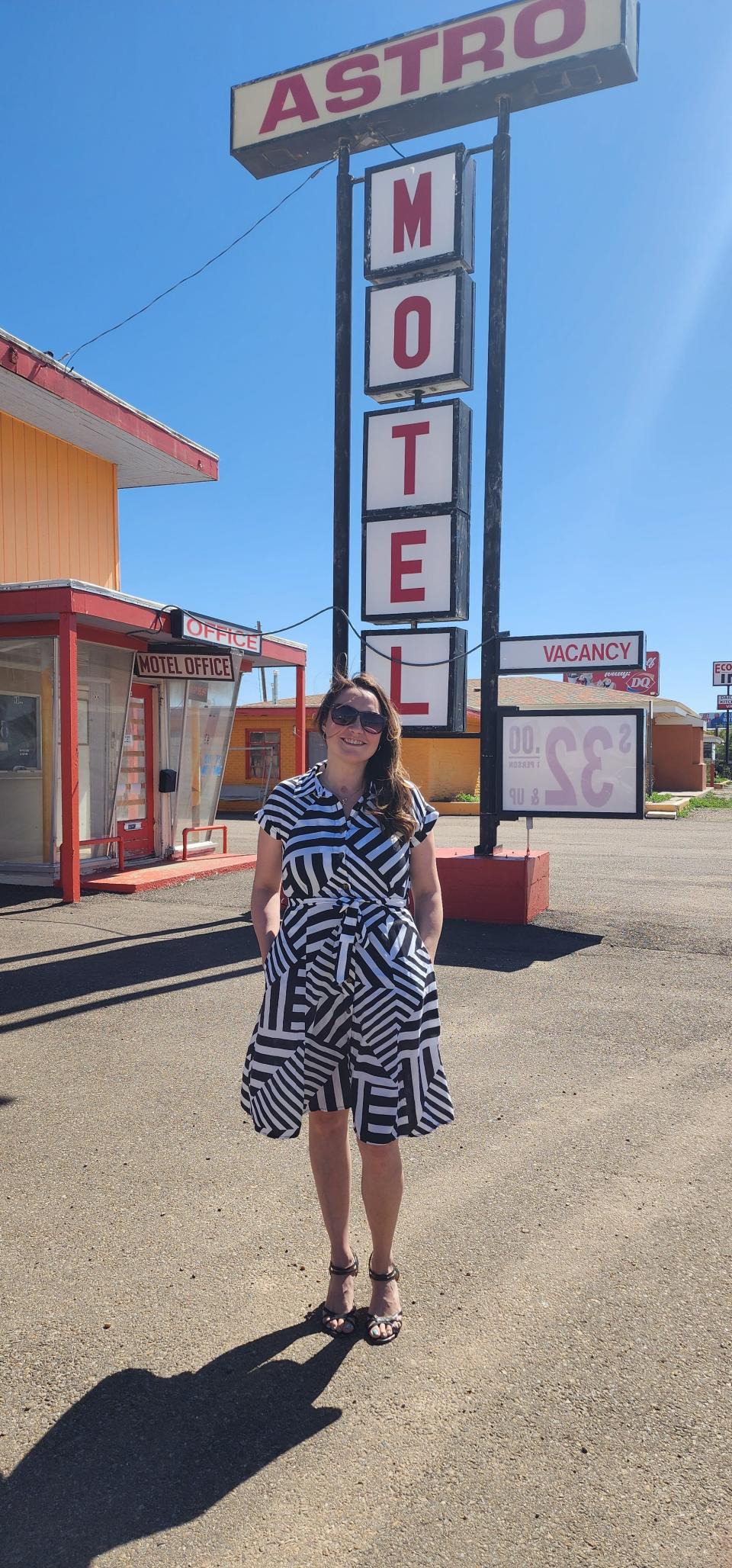 Tiffaney Belflower, founder of Homeless Heroes, stands in front of the Astro Motel Wednesday across from the Amarillo VA healthcare center.