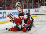 SUNRISE, FL - APRIL 15: Marcel Goc #57 of the Florida Panthers runs into Andy Greene #6 as goaltender Martin Brodeur #30 of the New Jersey Devils also falls to the ice in Game Two of the Eastern Conference Quarterfinals during the 2012 NHL Stanley Cup Playoffs at the BankAtlantic Center on April 15, 2012 in Sunrise, Florida. (Photo by Joel Auerbach/Getty Images)