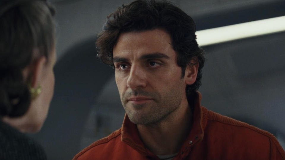 Oscar Isaac addresses Carrie Fisher on a starship bridge in Star Wars: The Last Jedi.