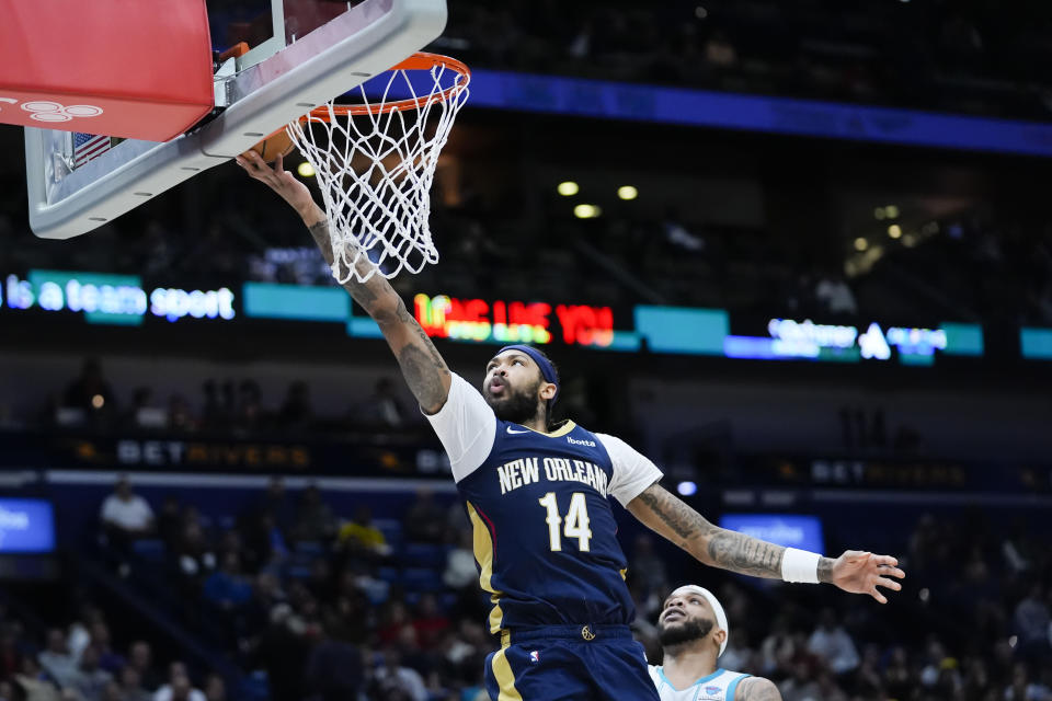 New Orleans Pelicans forward Brandon Ingram (14) goes to the basket in the second half of an NBA basketball game against the Charlotte Hornets in New Orleans, Wednesday, Jan. 17, 2024. The Pelicans won 132-112. (AP Photo/Gerald Herbert)