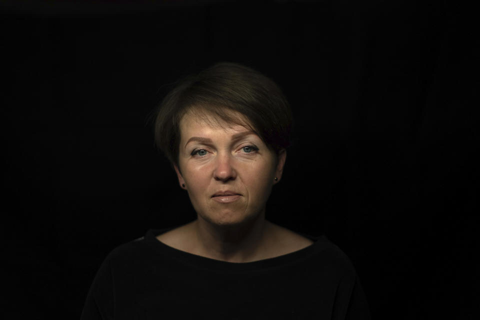 Olena Yahupova sits for a portrait in Zaporizhzhia, Ukraine, Thursday, May 18, 2023. Yahupova, a city administrator who was forced to dig trenches for the Russian forces in Zaporizhzhia, says, “If we don’t talk about it and keep silent, then tomorrow anyone can be there— my neighbor, acquaintance, child.” (AP Photo/Evgeniy Maloletka)
