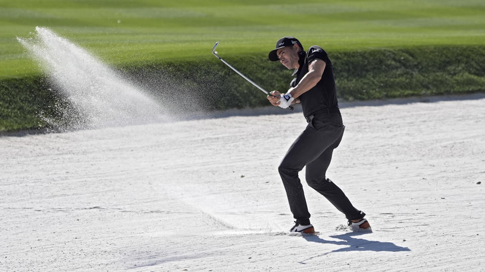 Camilo Villegas, of Colombia, hits from the sand trap on the ninth hole during the first round of The Players Championship golf tournament Thursday, March 14, 2024, in Ponte Vedra Beach, Fla. (AP Photo/Marta Lavandier)