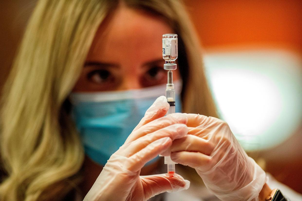 Pharmacist Madeline Acquilano fills a syringe with the Johnson & Johnson Covid-19 Vaccine before inoculating members of the public at Hartford Hospital in Hartford, Connecticut, on March 3, 2021. - Some 7,400 vials of the Johnson & Johnson Covid-19 single shot vaccine were delivered and an initial offering of the vaccine was given to ten members of the public. (Photo by Joseph Prezioso / AFP) (Photo by JOSEPH PREZIOSO/AFP via Getty Images)