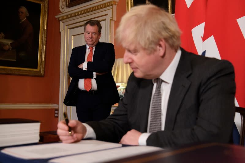 FILE PHOTO: Britain's Prime Minister Boris Johnson signs the Brexit trade deal with EU