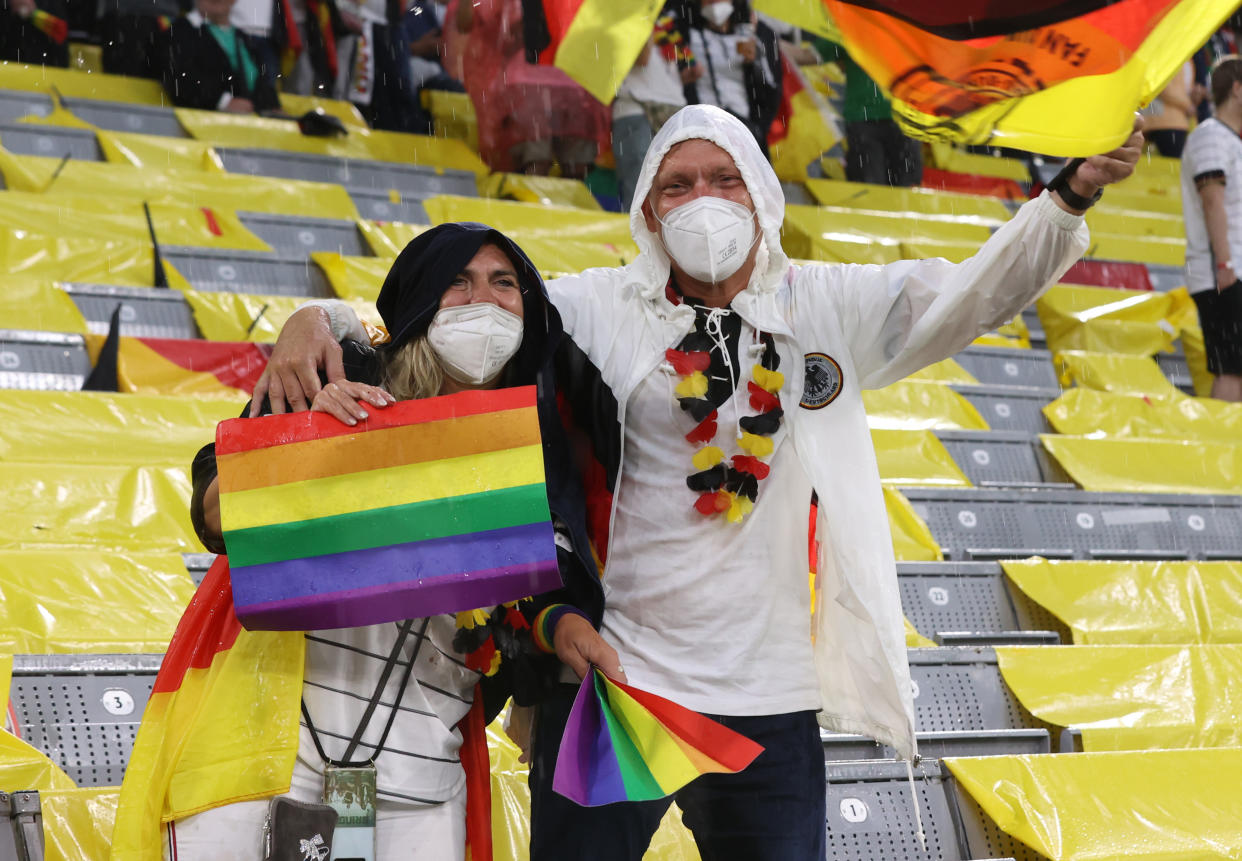 MUNICH, GERMANY - JUNE 23: Fans of Germany hold up rainbow flags prior to the UEFA Euro 2020 Championship Group F match between Germany and Hungary at Allianz Arena on June 23, 2021 in Munich, Germany. (Photo by Alexander Hassenstein/Getty Images)