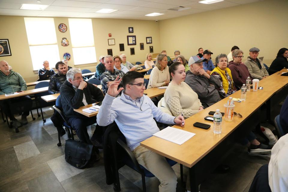 JD Biagioni raises his hand to speak during a hearing Monday, March 25, 2024 on the former Pizza by Paras structure, located next to his grandfather’s candy shop at York Beach.