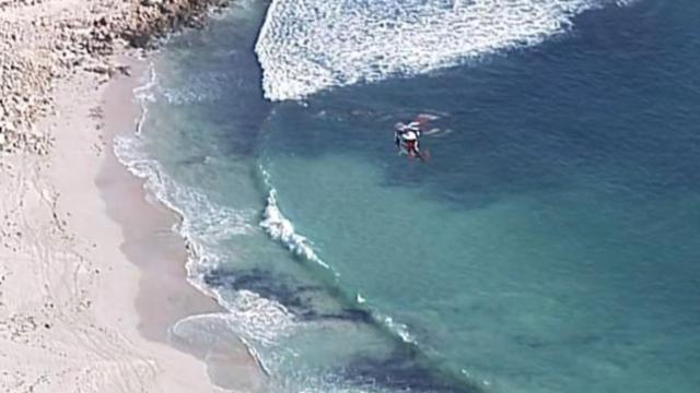 Emergency services were called to Walkers Rock Beach just after 10am on Saturday. Picture: 7 News