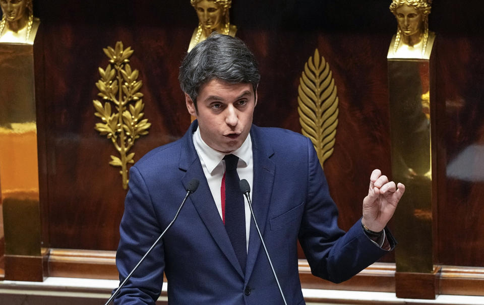 French Prime Minister Gabriel Attal gestures as he speaks to the lawmakers at the National Assembly, Tuesday, Jan. 30, 2024 in Paris. French Prime Minister Gabriel Attal said on Tuesday his top priority is to boost employment in his general policy address to lawmakers, three weeks after he was appointed. Attal is facing his first major challenge as angry farmers are protesting across the country and around Paris against low wages and other problems.(AP Photo/Michel Euler)