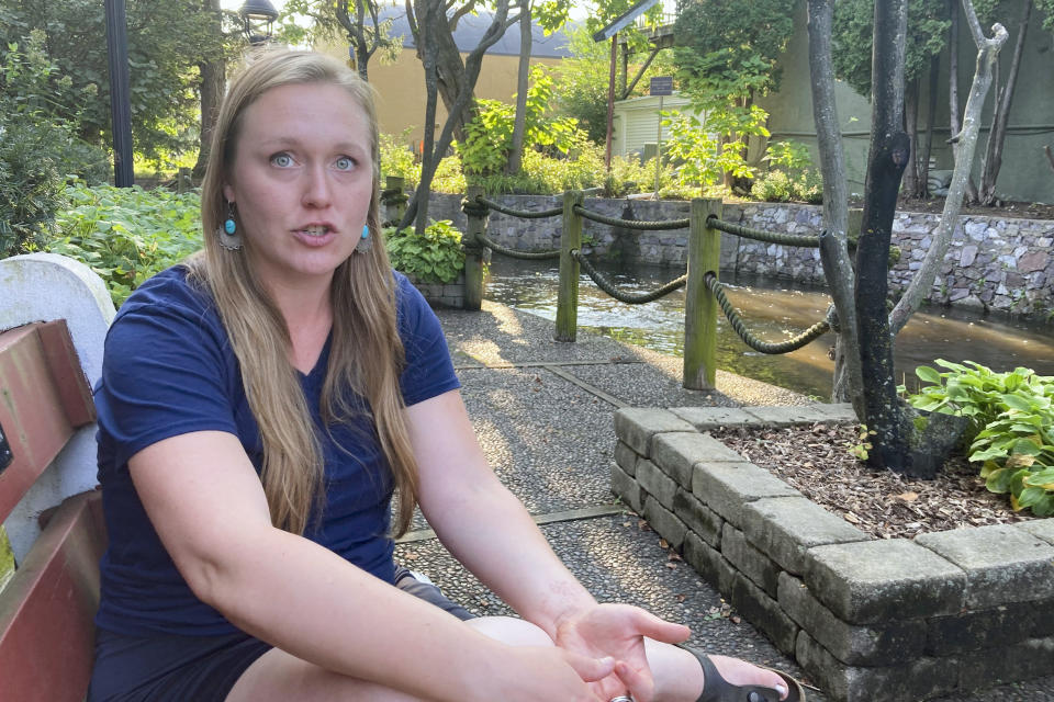 Dilaine Noel, from politically competitive Columbia County, Wisconsin, talks in a downtown park in Lodi, Wis, on Sept. 12, 2022. The 29-year-old data analyst and political independent says the June U.S. Supreme Court decision overturning Roe v. Wade is forcing her to vote Democratic this fall "by default." She is among independent voters nationally who have drifted toward supporting Democrats in November in light of the court decision and mixed messaging from Republicans over the summer. (AP Photo/Thomas Beaumont)