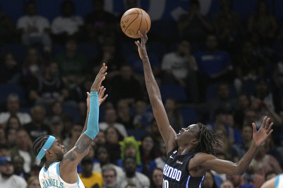 Orlando Magic center Bol Bol (10) blocks a shot by Charlotte Hornets forward Jalen McDaniels, left, during the first half of an NBA basketball game, Friday, Oct. 28, 2022, in Orlando, Fla. (AP Photo/Phelan M. Ebenhack)