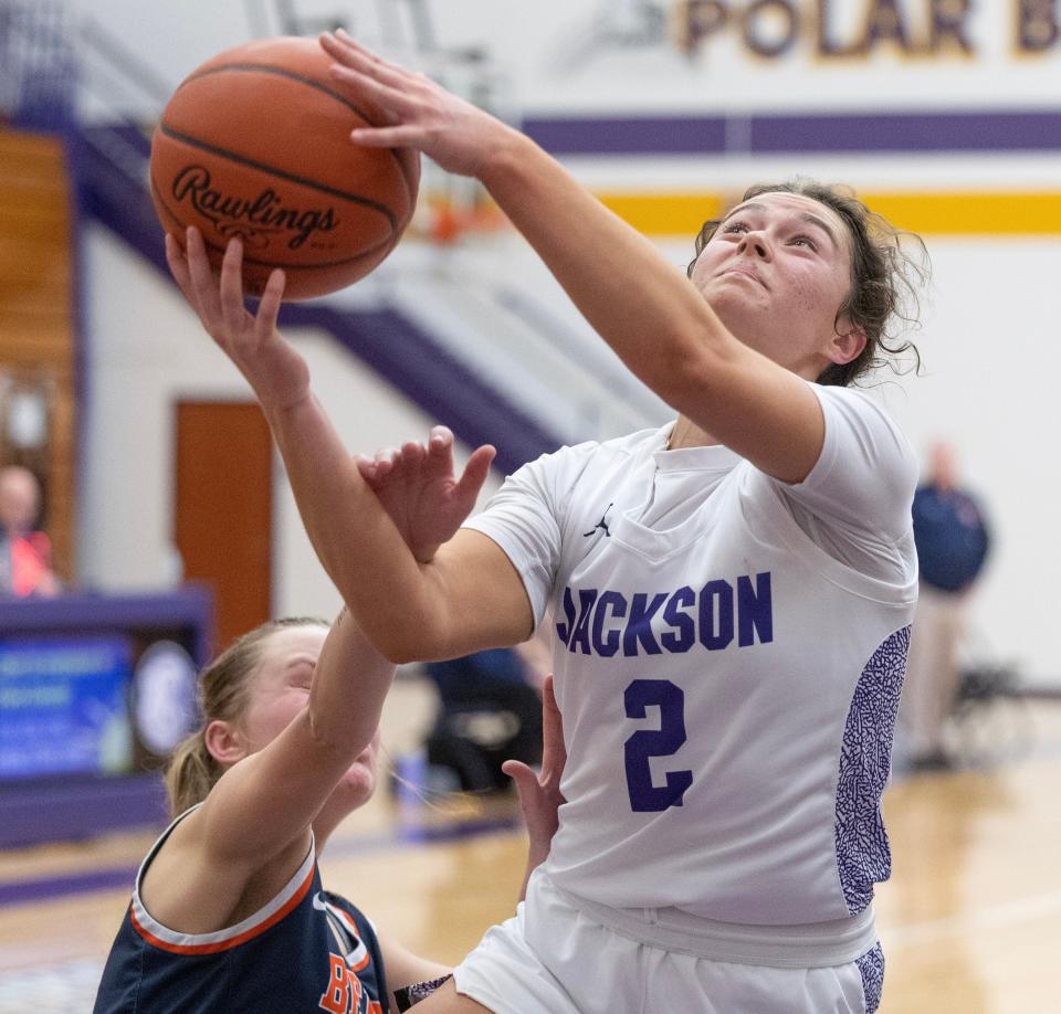 Jackson's Ashley Lahmers works to get past the defense of Berea -Midpark's Casey Friel in the second half during a DI sectional game at Jackson Thursday, Feb. 22, 2024.