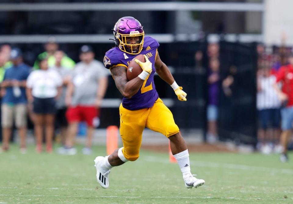 East Carolina running back Keaton Mitchell (2) heads downfield during the second half of N.C. State’s 21-20 victory over ECU at Dowdy-Ficklen Stadium in Greenville, N.C., Saturday, Sept. 3, 2022.