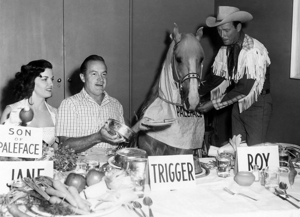 Jane Russell, Bob Hope, Trigger, Roy Rogers having lunch in the Paramount Studio commissary in honor of opening of SON OF PALEFACE, 1952