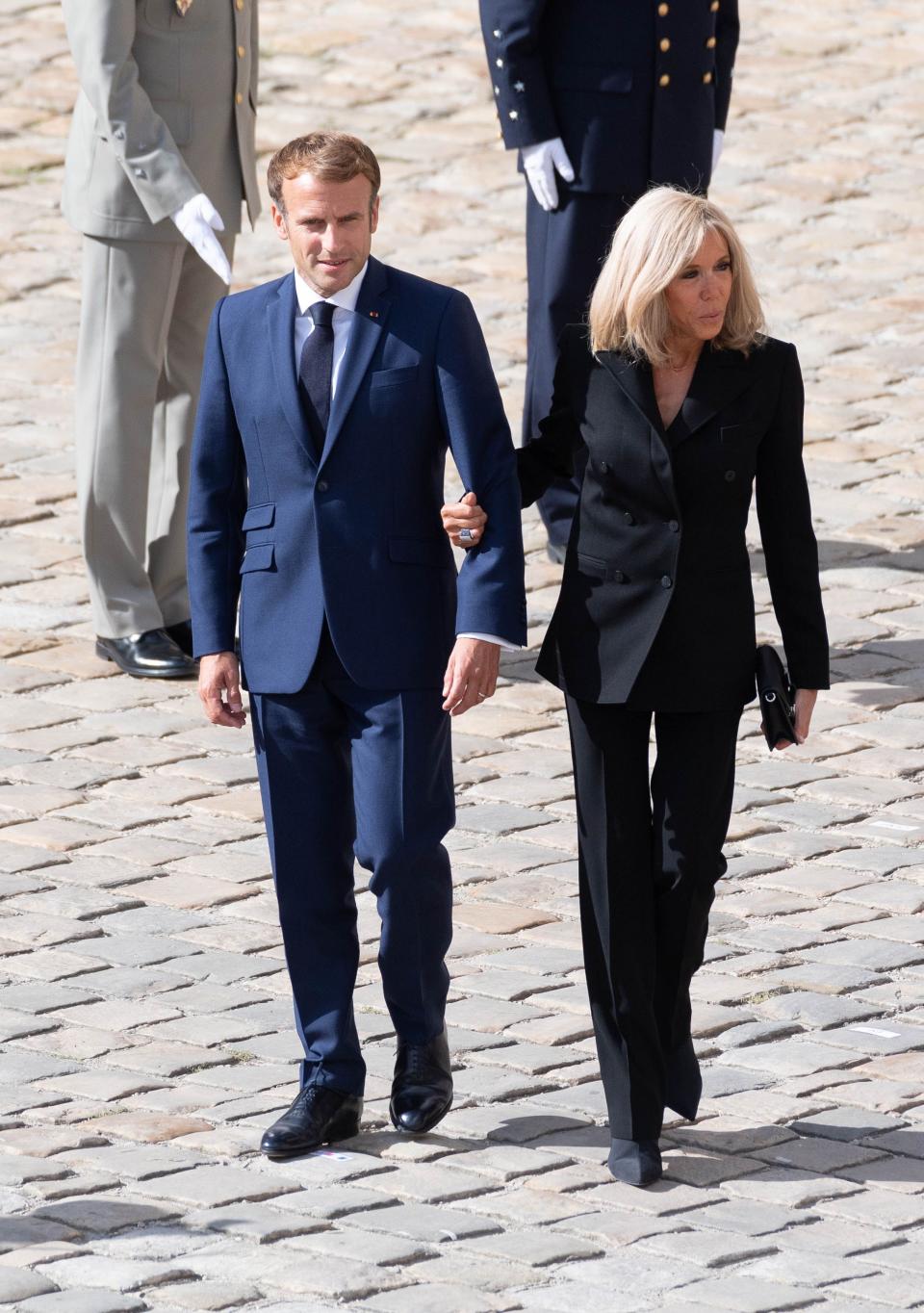 France’s President Emmanuel Macron (L) and his wife Brigitte Macron at the national tribute ceremony to late French actor Jean-Paul Belmondo at the Hotel des Invalides monument in Paris on Sept. 9, 2021. - Credit: Jacques WITT/SIPA