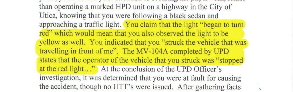 An excerpt from Herkimer Police Department's disciplinary records describes how Officer Robert Holt crashed his police vehicle into another car when it was stopped at a red light.