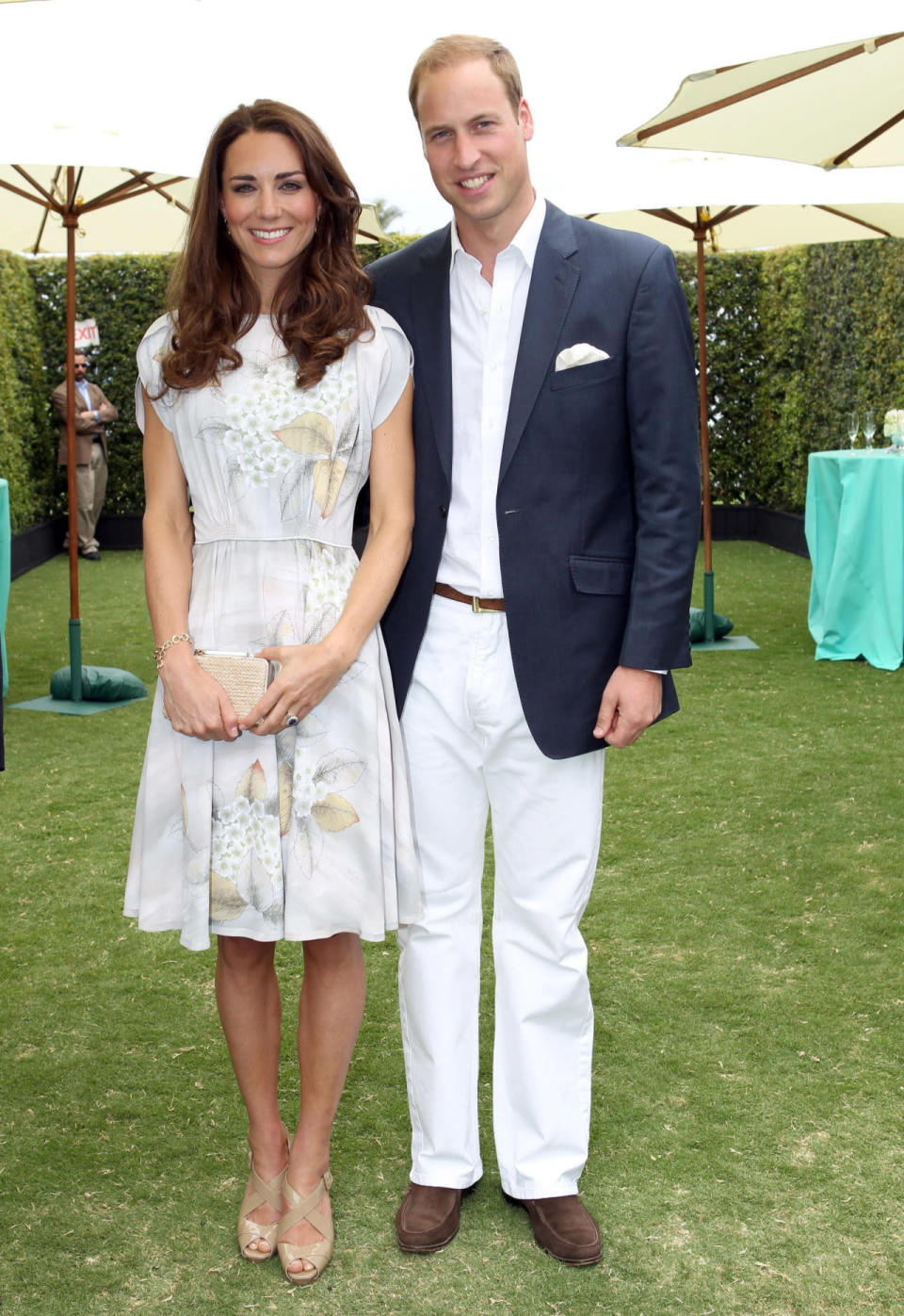 <p>The Duchess wore a handpainted silk dress by Jenny Packham for a polo match in Santa Barbara. L.K. Bennett sandals and a matching bag topped off her outfit. </p><p><i>[Photo: PA]</i></p>