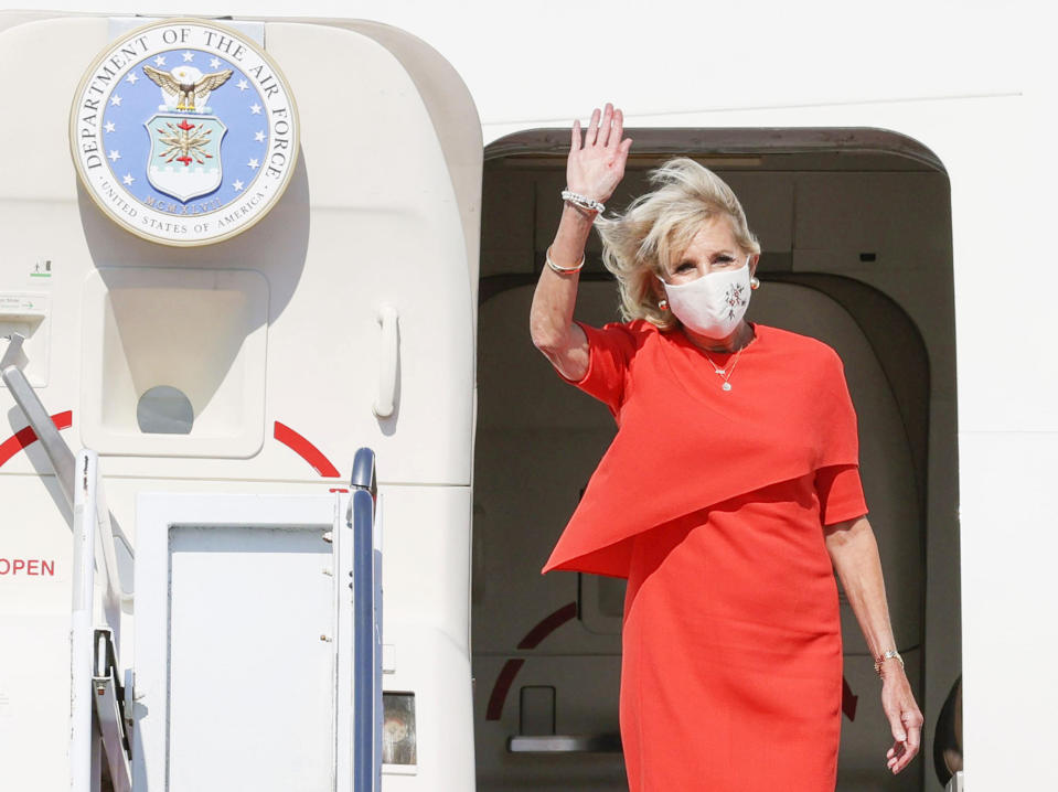 U.S. first lady Jill Biden waves upon arrival at Yokota U.S. Air Force Base, outskirts of Tokyo, Thursday, July 22, 2021. Biden represented the U.S. government at the Tokyo Olympics, to attend the opening ceremony of the Games on Friday, July 23. (Kyodo News via AP)