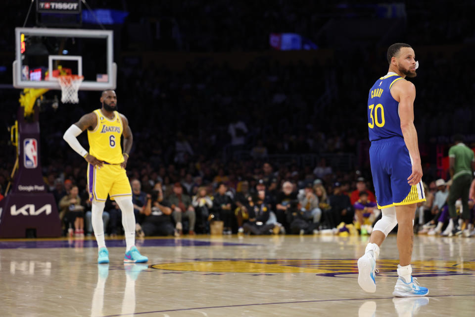 Los Angeles Lakers superstar LeBron James and Golden State Warriors counterpart Stephen Curry can both envision one last shot at a title, but only one will advance. (Harry How/Getty Images)