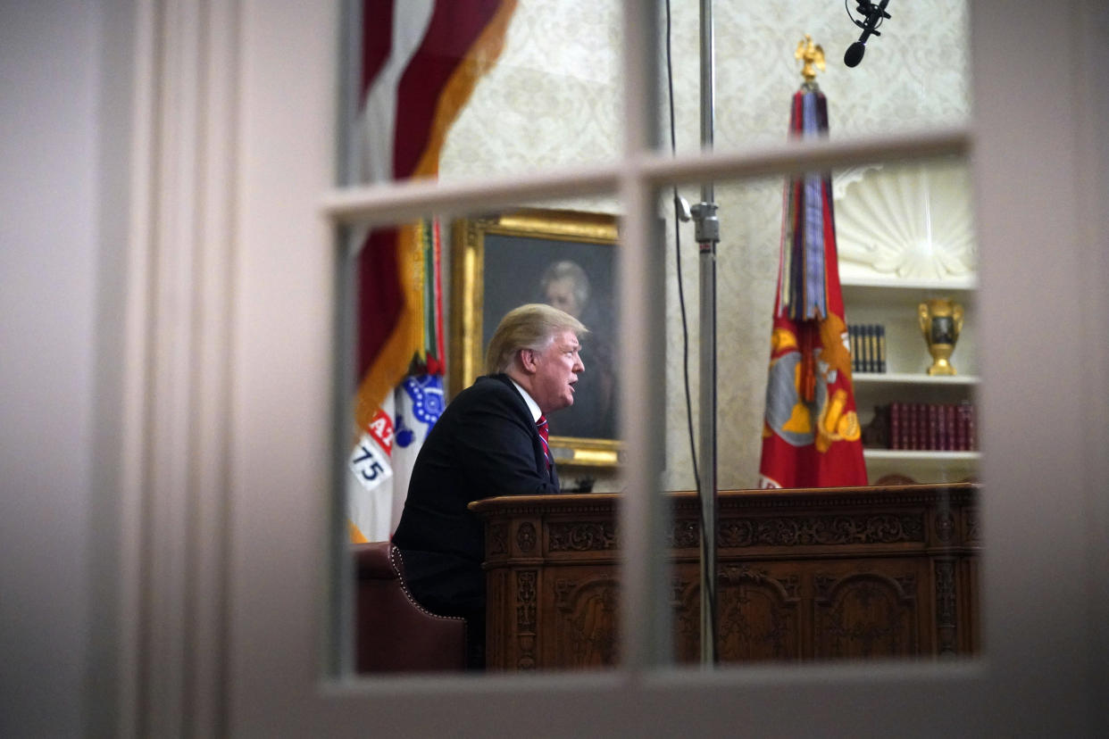 As seen from a window outside the Oval Office, President Donald Trump gives a prime-time address about border security Tuesday, Jan. 8, 2018, at the White House in Washington. (AP Photo/Carolyn Kaster) (Photo: ASSOCIATED PRESS)