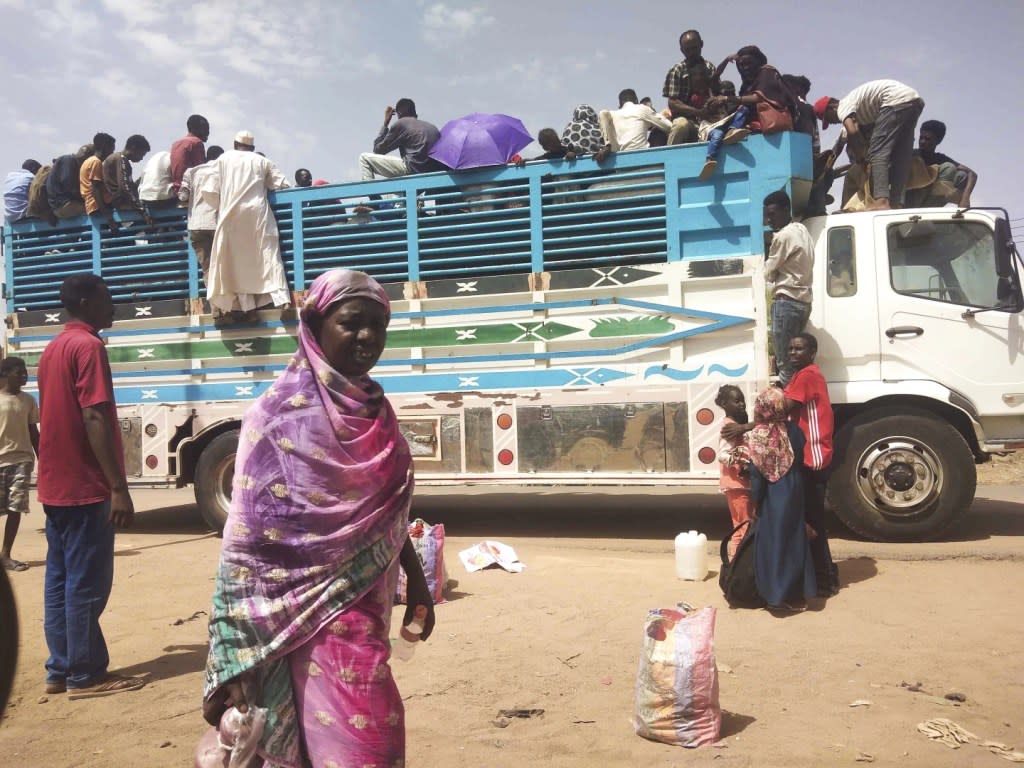 People board a truck as they leave Khartoum, Sudan, on June 19, 2023. (AP Photo, File)