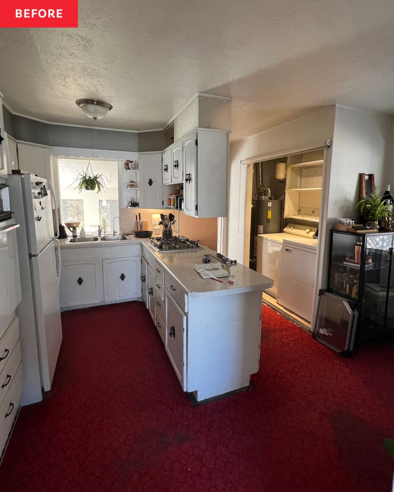 white kitchen with white cabinets and red carpeting before remodel