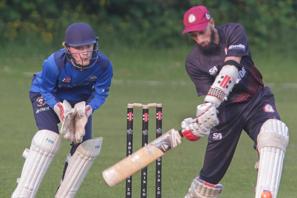 Tonge batsman, Shoyab Haji, is watched by Astley Bridge wicketkeeper, Jake Bailey. Picture by Harry McGuire