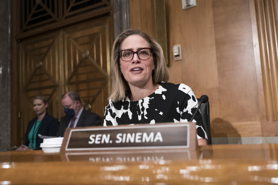 FILE -Sen. Kyrsten Sinema, D-Ariz., arrives for a meeting of the Senate Homeland Security Committee at the Capitol in Washington, Wednesday, Aug. 3, 2022. Sen. Kyrsten Sinema, D-Ariz., a centrist who was seen as the pivotal vote, said in a statement that she had agreed to changes in the measure's tax and energy provisions and was ready to “move forward” on the bill, Thursday, Aug. 4, 2022 . (AP Photo/J. Scott Applewhite, File)