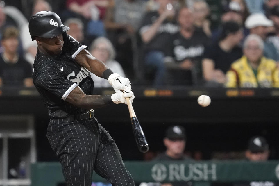 Chicago White Sox's Tim Anderson hits an RBI double off Cleveland Guardians starting pitcher Zach Plesac during the seventh inning of a baseball game Monday, May 9, 2022, in Chicago. Leury Garcia scored on the play. (AP Photo/Charles Rex Arbogast)