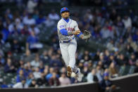 New York Mets shortstop Francisco Lindor stops his throw to first on a ball hit by Chicago Cubs' Christopher Morel during the sixth inning of a baseball game Wednesday, May 24, 2023, in Chicago. (AP Photo/Charles Rex Arbogast)