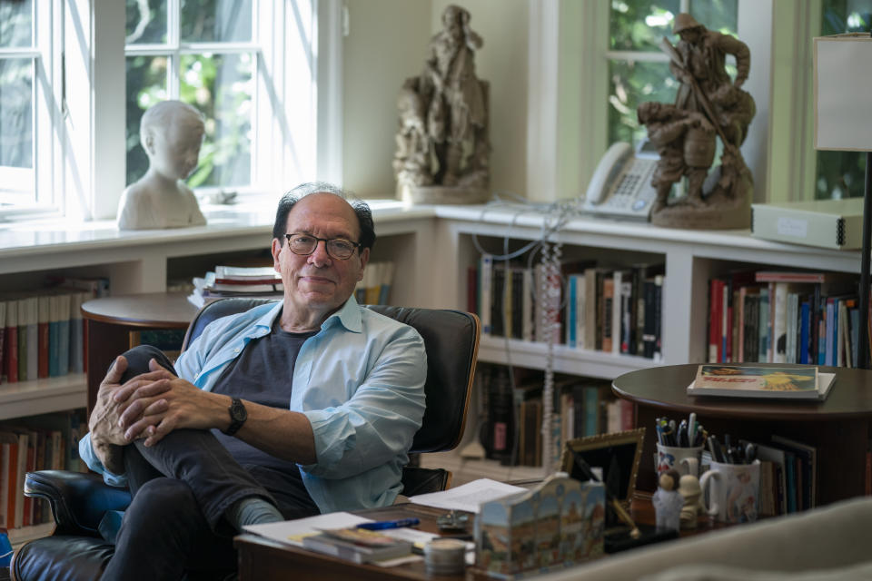 Playwright Ken Ludwig poses for a portrait in his home, Friday, Aug. 12, 2022, in Washington. Ludwig has revisited one of his most beloved plays and flipped the characters’ genders. “Lend Me a Soprano” inverts Ludwig’s madcap screwball comedy “Lend Me a Tenor” by having ladies take the lead three parts, a change he initiated so that a whole new raft of comedians could shine. “Lend Me a Soprano” makes its world premiere this fall at the Ally Theatre in Houston on Sept. 16. (AP Photo/Evan Vucci)