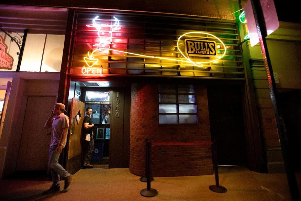 Joel Jandel mans the door at Bull’s Tavern on Friday, June 16, 2023, the night before Cal Poly’s graduation weekend. The bar has been a fixture of San Luis Obispo’s downtown scene since the 1930s. Laura Dickinson/The Tribune