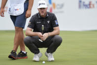 Taylor Pendrith lines up a putt on the 17th hole during the first round of the Byron Nelson golf tournament in McKinney, Texas, Thursday, May 2, 2024. (AP Photo/LM Otero)
