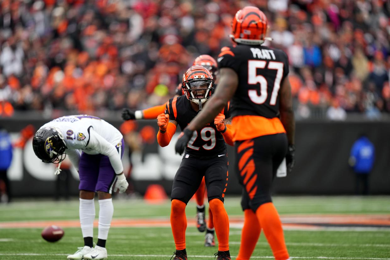 Jan 8, 2023; Cincinnati, Ohio, USA; Cincinnati Bengals cornerback Cam Taylor-Britt (29) reacts toward Cincinnati Bengals linebacker Germaine Pratt (57) after a near interception in the second quarter during a Week 18 NFL game at Paycor Stadium in Cincinnati. Mandatory Credit: Kareem Elgazzar-The Cincinnati Enquirer-USA TODAY Sports