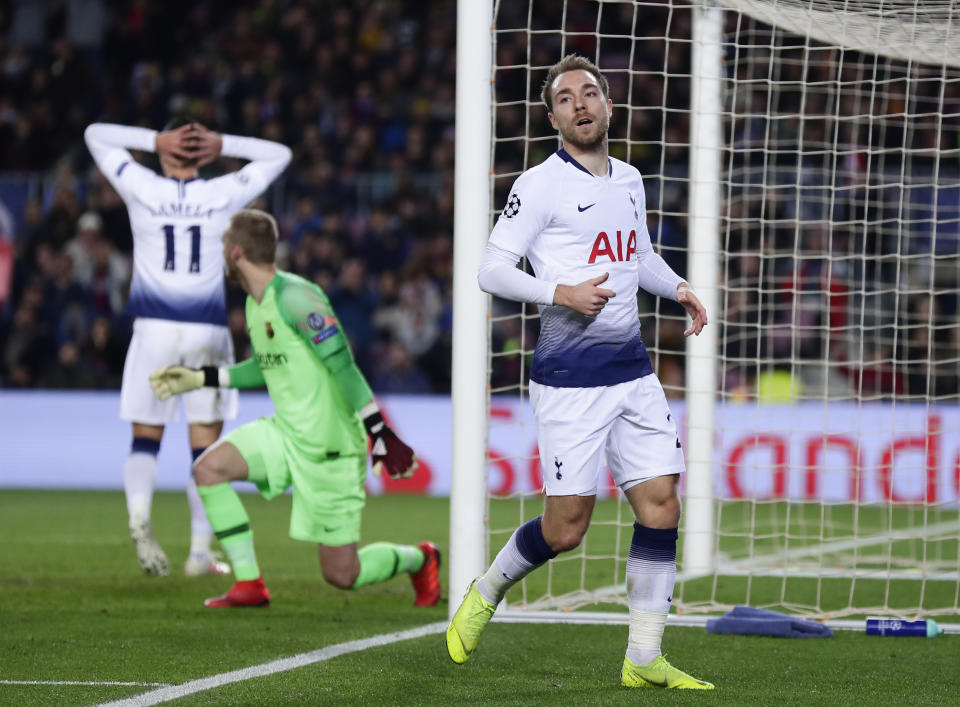 Tottenham midfielder Christian Eriksen, right, reacts after missing an opportunity to score during the Champions League group B soccer match between FC Barcelona and Tottenham Hotspur, at the Camp Nou stadium, in Barcelona, Spain, Tuesday, Dec. 11, 2018.(AP Photo/Manu Fernandez)