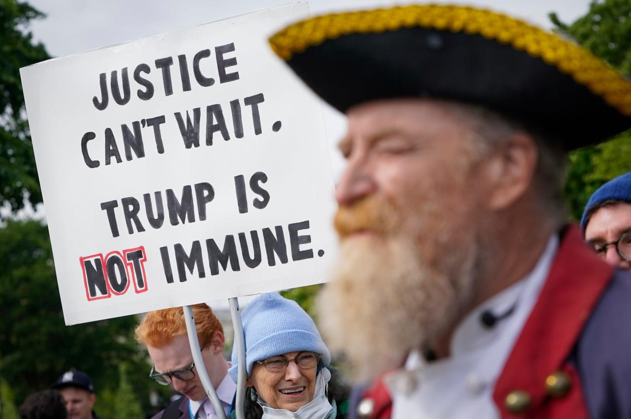 Protestors gather outside of the US Supreme Court on April 25, 2024 as the Supreme Court justices hear oral arguments on whether former President Donald Trump is immune from criminal charges in his federal election interference case in Washington, DC.