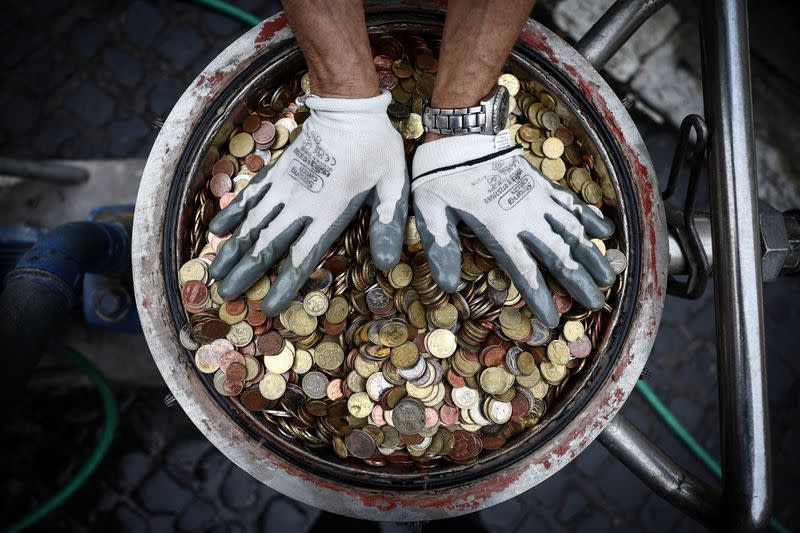 The Wider Image: What happens to the coins tossed into Rome's Trevi Fountain?