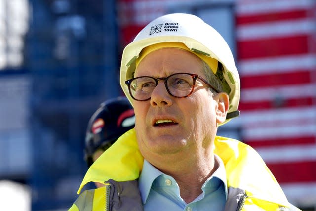 Labour Party leader Sir Keir Starmer wearing a yellow hard hat and yellow hi-vis jacket at the launch of a new Freedom to Buy scheme during a visit to a housing development in north-west London while on the 2024 General Election campaign trail