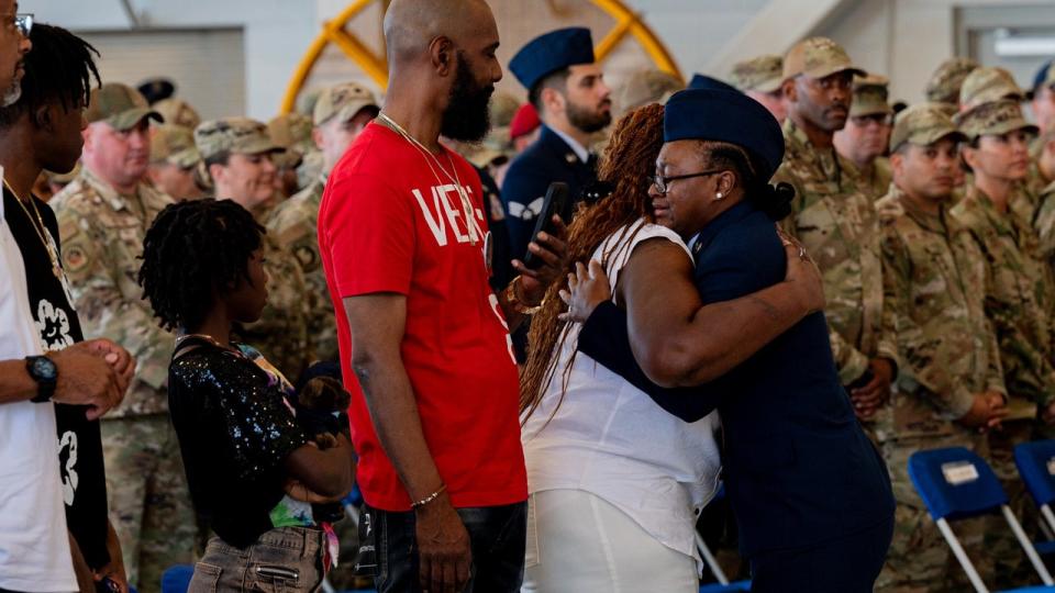 <div>Senior Airman Ayanna Dickerson, 1st Special Operations Munitions Squadron aircraft armament systems technician, embraces Senior Airman Roger Fortson’s mother after singing the national anthem during a memorial service, Hurlburt Field, Florida, May 20, 2024. (U.S. Air Force photo by Staff Sgt. Alex Stephens)</div>